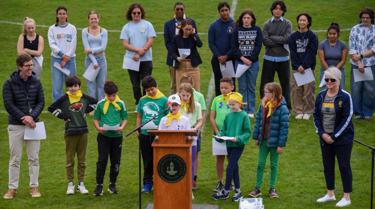 YOUNG VOICES. The fifth grade principles council speaks to the school.