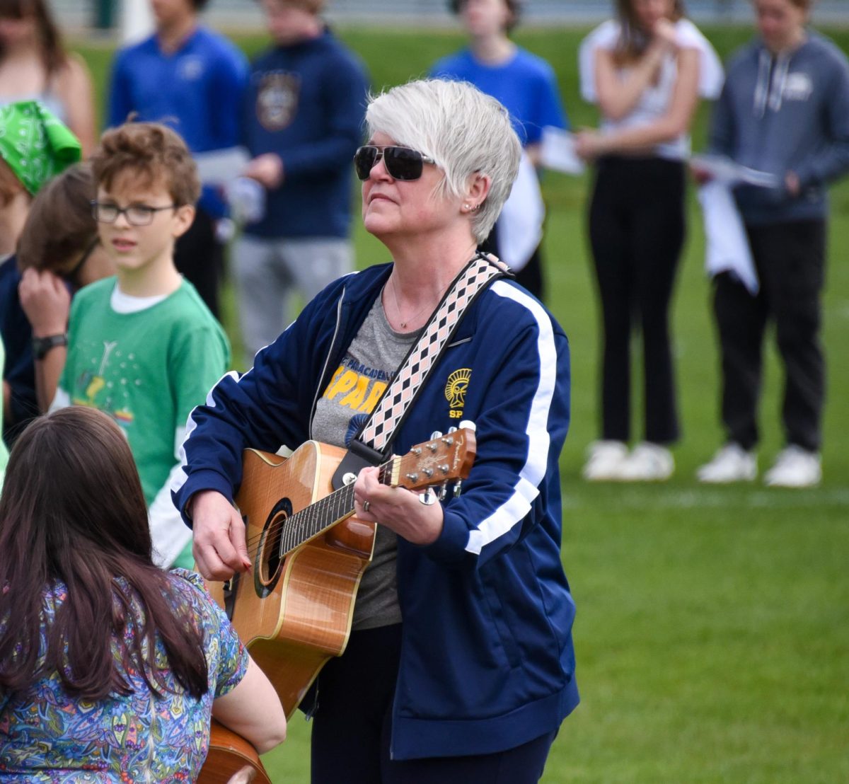ROCK ON. Elementary Principle Beth Nelson plays guitar for "Stand Up."