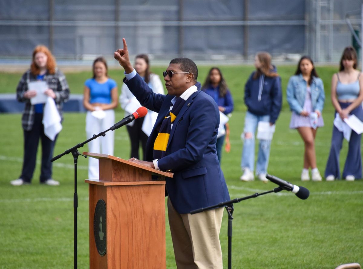 GO FAR. Head of School Luis Ottley speaks to the entire school. "If you want to go fast, go alone, but travel together if you want to go far," Ottley said during his speech.