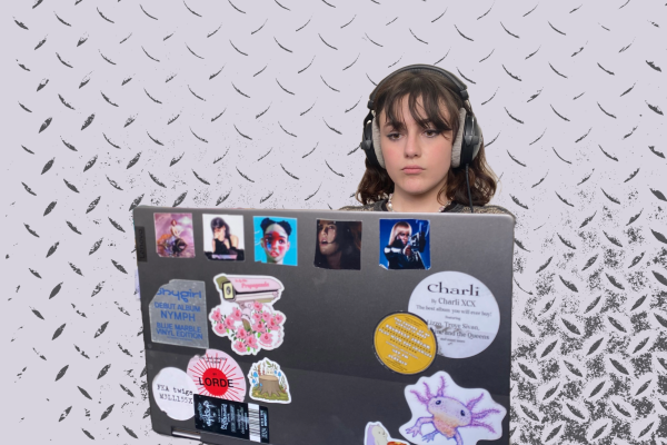 POP PRODUCTION. Gunther works on a track during her free time at school. The back of her laptop is decorated with stickers of artists she admires, such as Charli XCX and Shygirl.