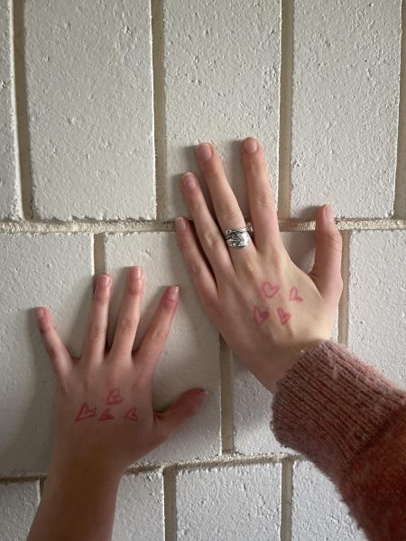 DRAW A HEART. The Pink Heart Project, created by sophomores Beatrix Rhone and Elzie Bieganek, hopes to build visible solidarity and support for survivors of sexual assault.