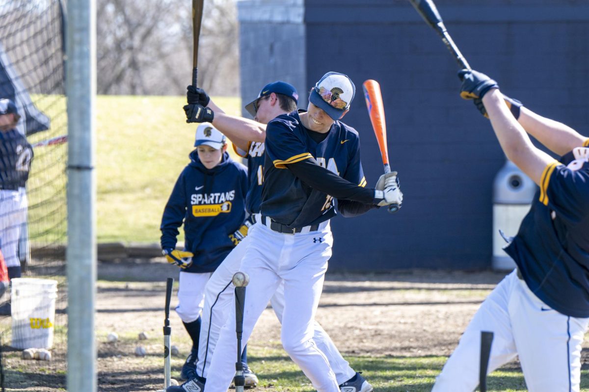 PRACTICE. Junior Liam Huddleston practices batting with the rest of the baseball team. When I’m not playing well, I always try to focus on the next at-bat or play instead of getting caught up in my previous mistakes, he said.