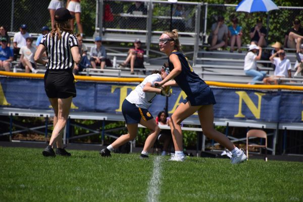 GAME TIME. The game's first faceoff, with sophomore Dia Chaney, after gaining possession for the Spartans.