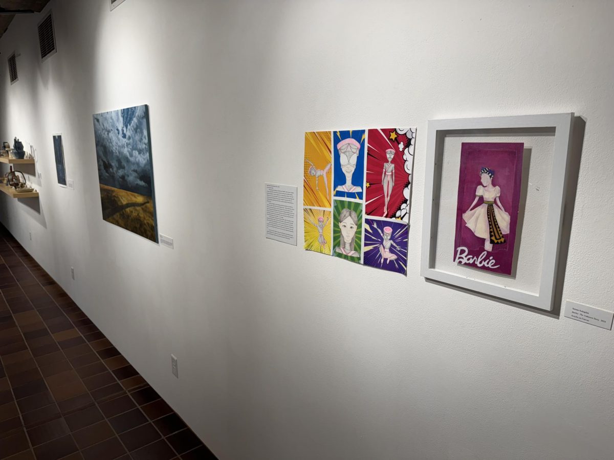 SPOTLIGHT. Bright white lighting highlights the multiple mediums of artwork. 