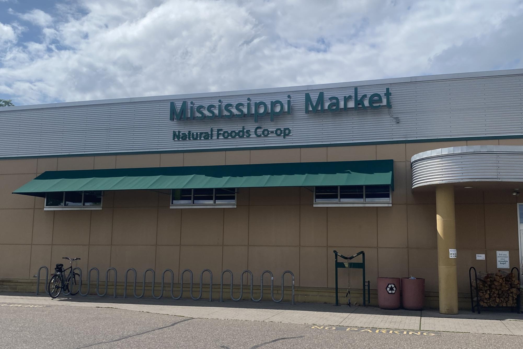 MISSISSIPPI MARKET CO-OP. The co-op building stands under the bright sun. This location on 7th Street West is the largest of the three locations.
