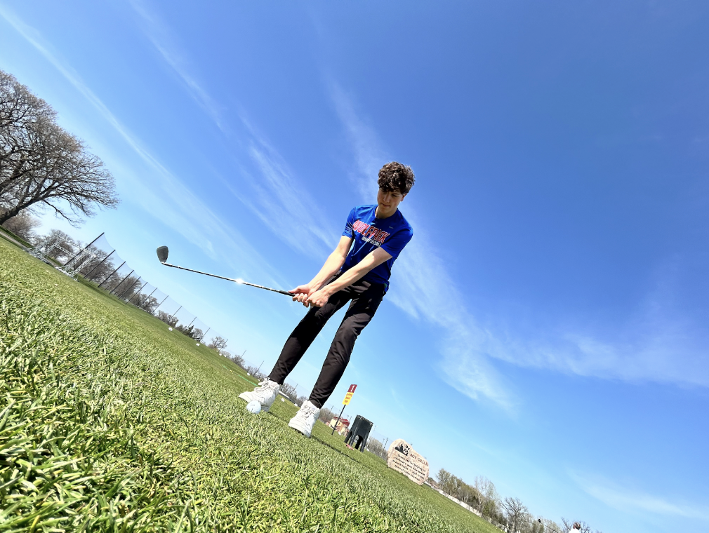 Freshman Adem Rivers, practicing his short game at University of Minnesota Driving Range.