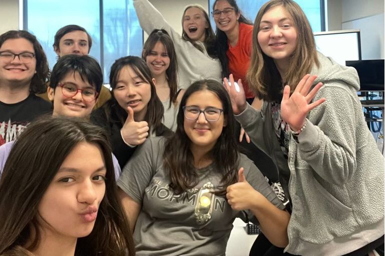 BOOKS UNITE. Book Club members come together in the math classroom to celebrate the class of 2024 before senior projects. Junior Grace Medrano said, "We [Medrano and Raven Glaser] took over last month [as the new leaders], so we’ll be running it next year." (Submitted photo by Grace Medrano) 