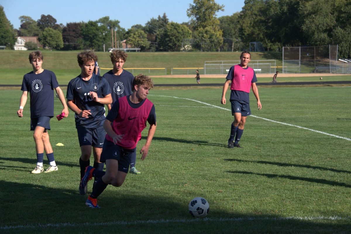 GET READY. Split into two teams, the boys run scrimmages to warm up before the game. 