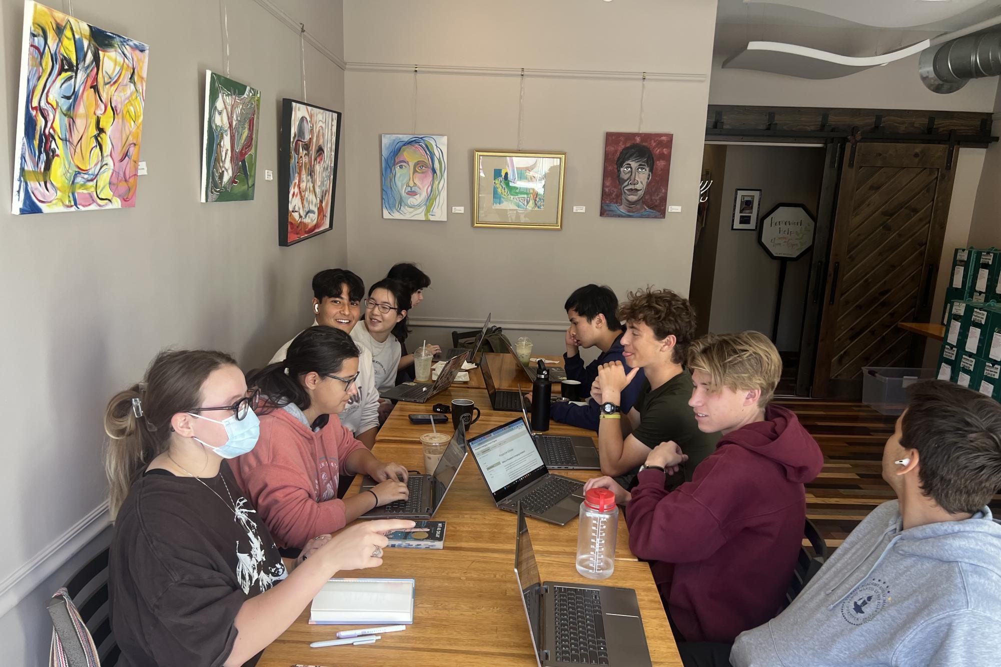 COFFEE w/FRIENDS. Deling Chen, and others use some of thier senior writing to socialize.
