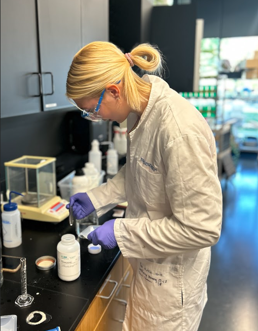 Inga Wing measures sodium sulfite, a material she is using in her project, attempting to find a more accessible way to detect fluorinated substances in ski waxes. "It will work in tandem with ultraviolet light to degrade the carbon-fluorine bond in fluorinated waxes" Wing said. 