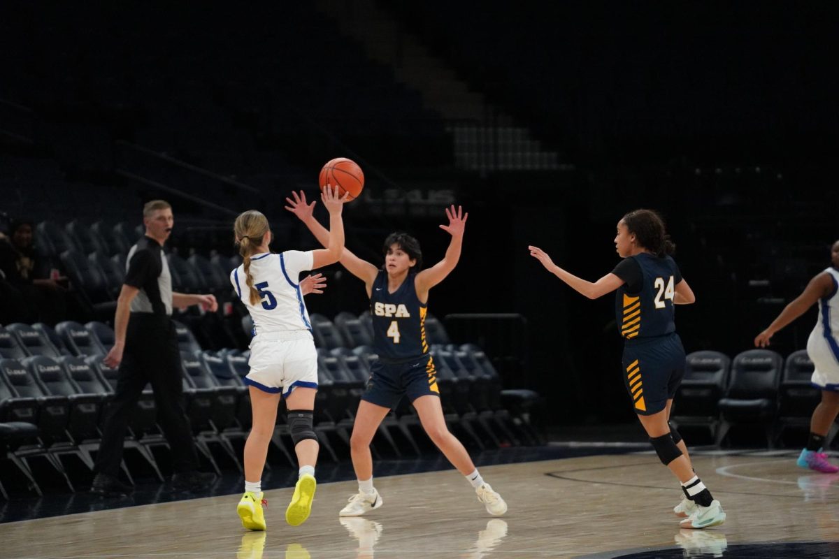 HANDS UP. Nelson and Taylor play defense.