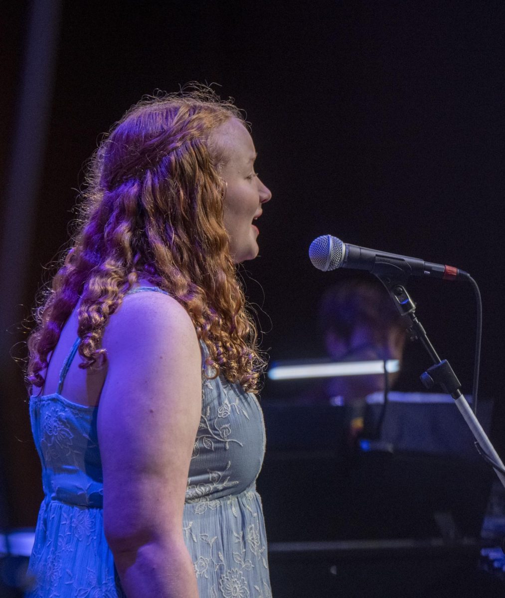 POWERFUL PERFORMANCE. Sophomore Johnson performs with the choir at the MS and US joint choral performance. Johnson said. “I tried all the activities ... like, every sport under the sun ... theater just stuck out. (SPA Smugmug, Scott Streble)