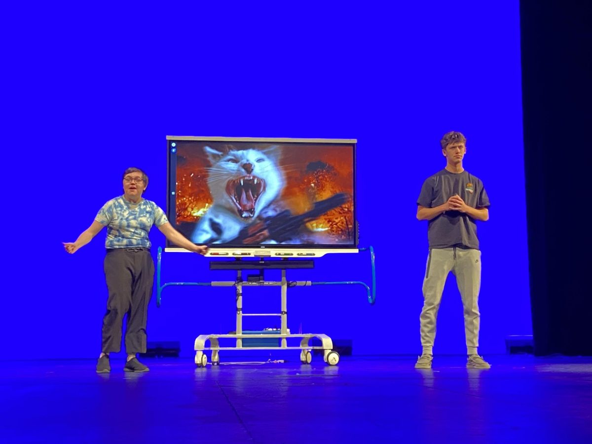 KILLER CATS. Goff (left) and Wall (right) present the audience one of the likely apocalyptic scenarios: cats with chainsaws. 