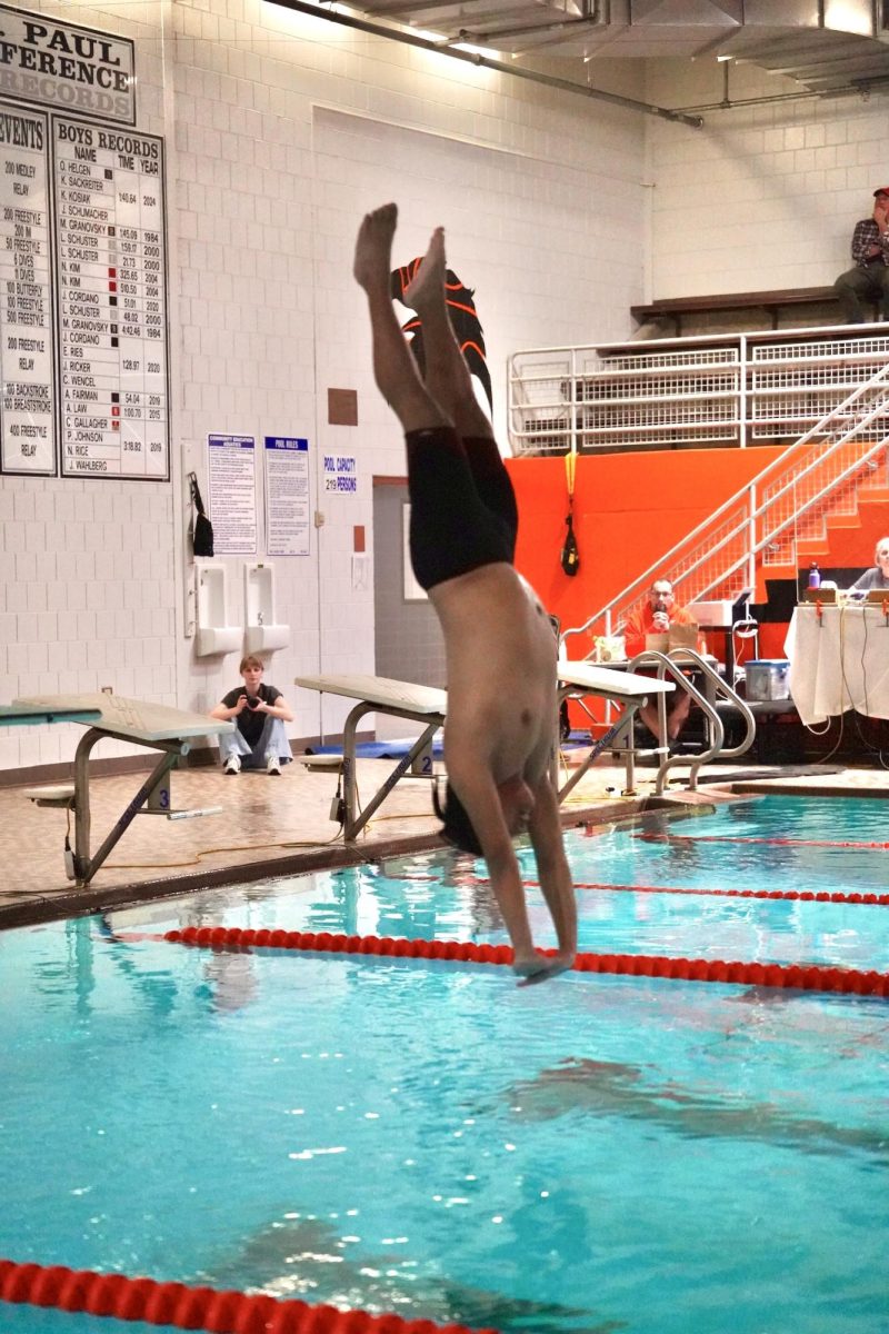 STRAIGHT LINE. Highland Park swimmer takes on diving for the first time.