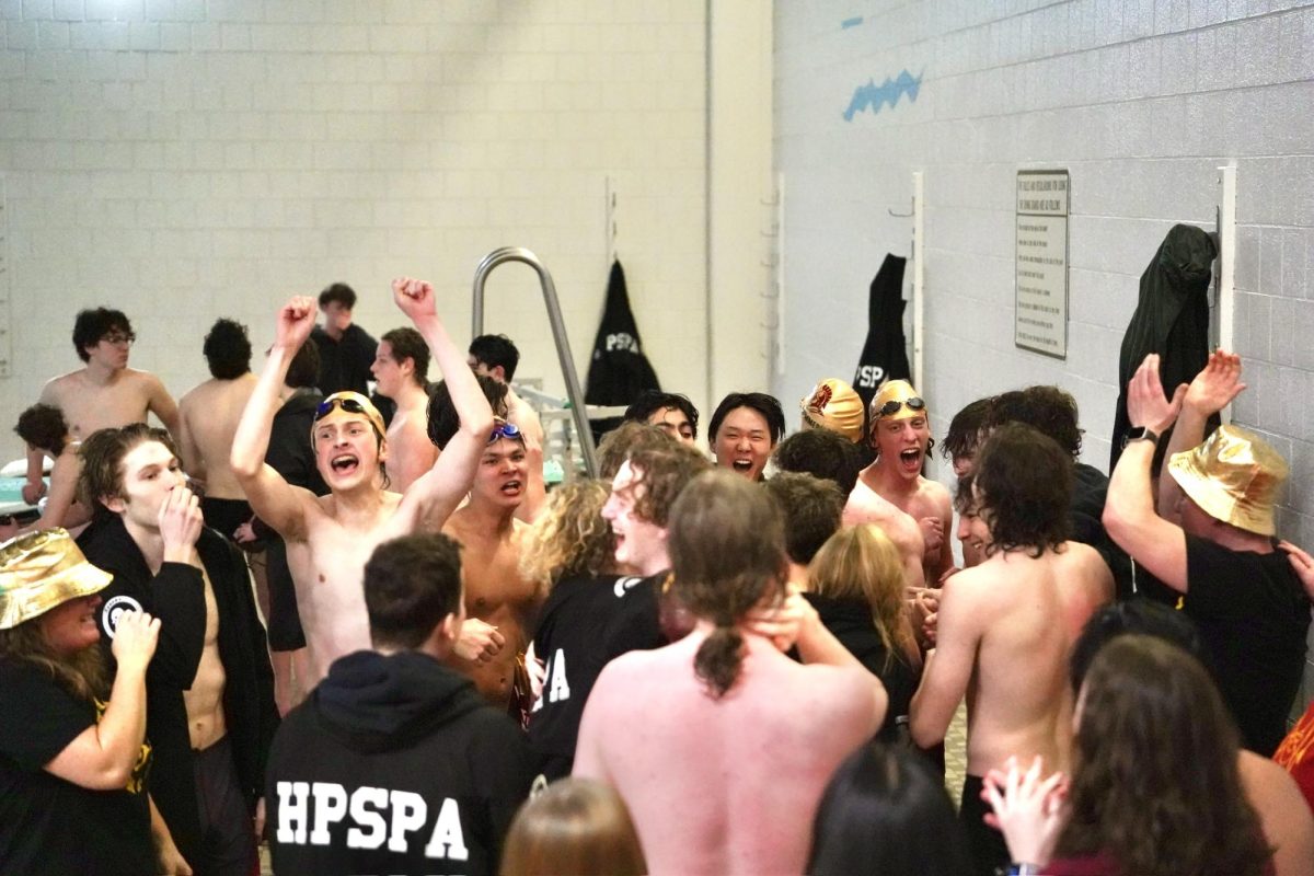 YAY. Trojans swimmers come together to celebrate their win.