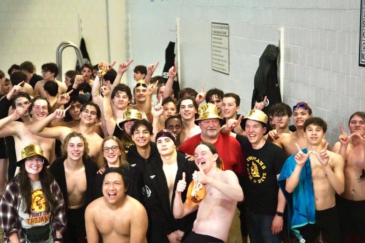 NUMBER ONE. The entirety of Trojan swim and dive smile while celebrating their first St. Paul Conference win since 2020. 
