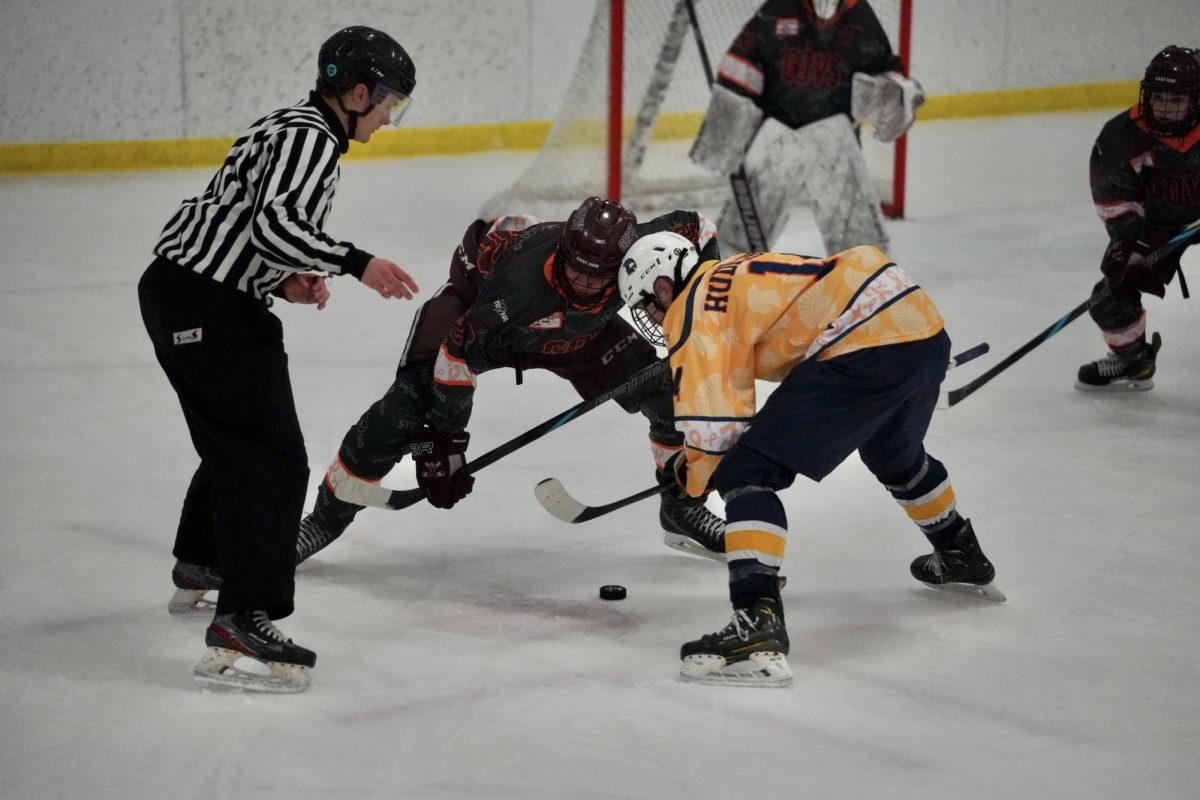 WIN THE FACE OFF. Senior Liam Huddleston wins the face off to shoot on Johnson's goalie.