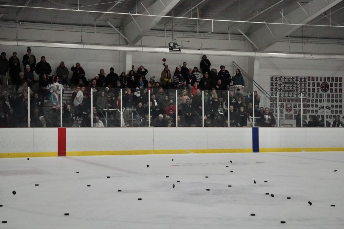 CHUCK-A-PUCK. Fans paid five dollars per puck to try to get it to land on center ice for a prize.