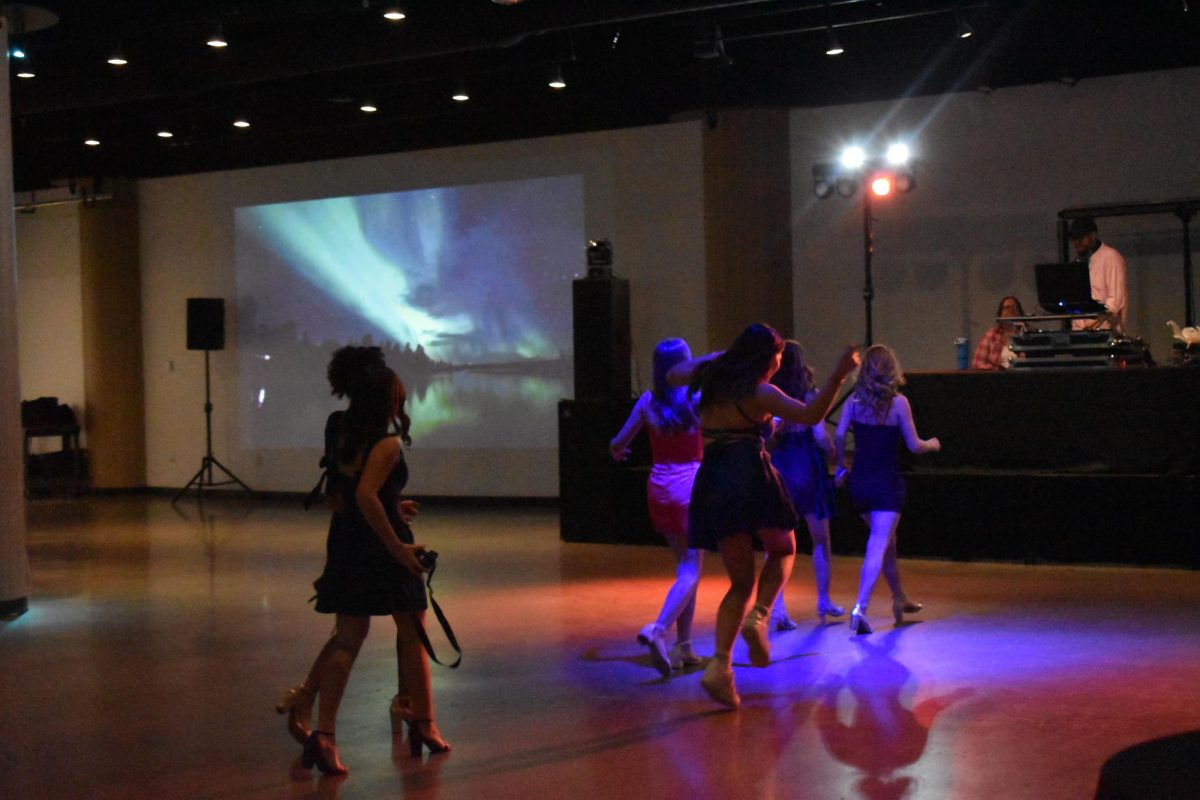 NEXT SONG. A friend group of freshmen girls wanted to request a song they liked to the DJ and rushed to the front as the current song approached the end. 