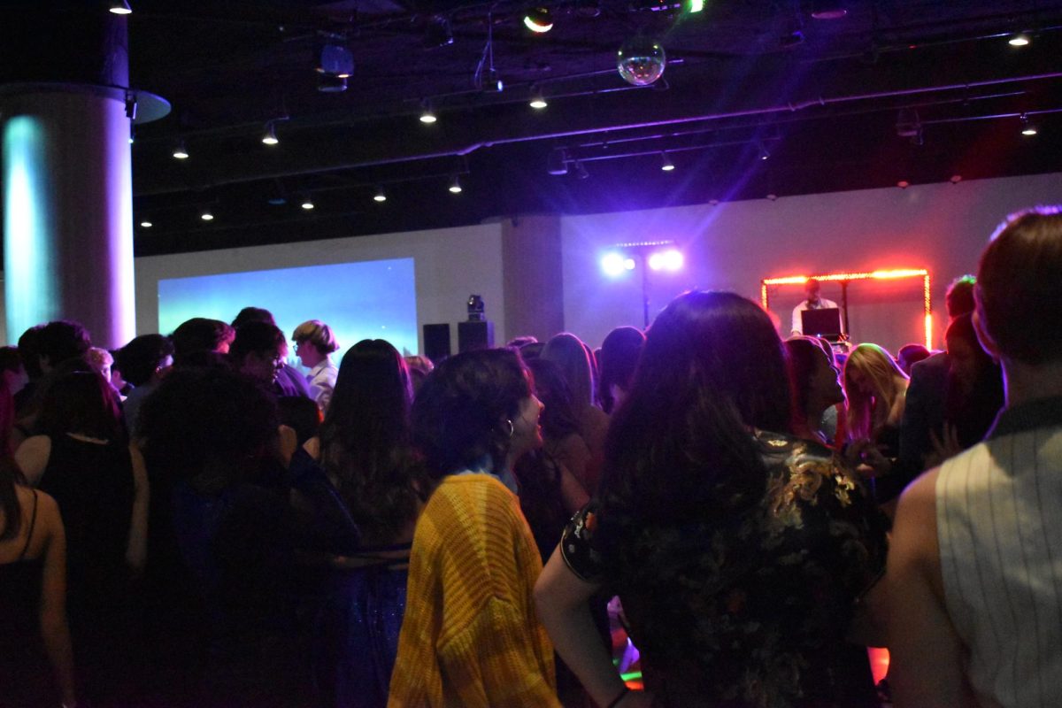 TWIST AND SHOUT. Students unwind at the dance with friends and wiggles to upbeat music.