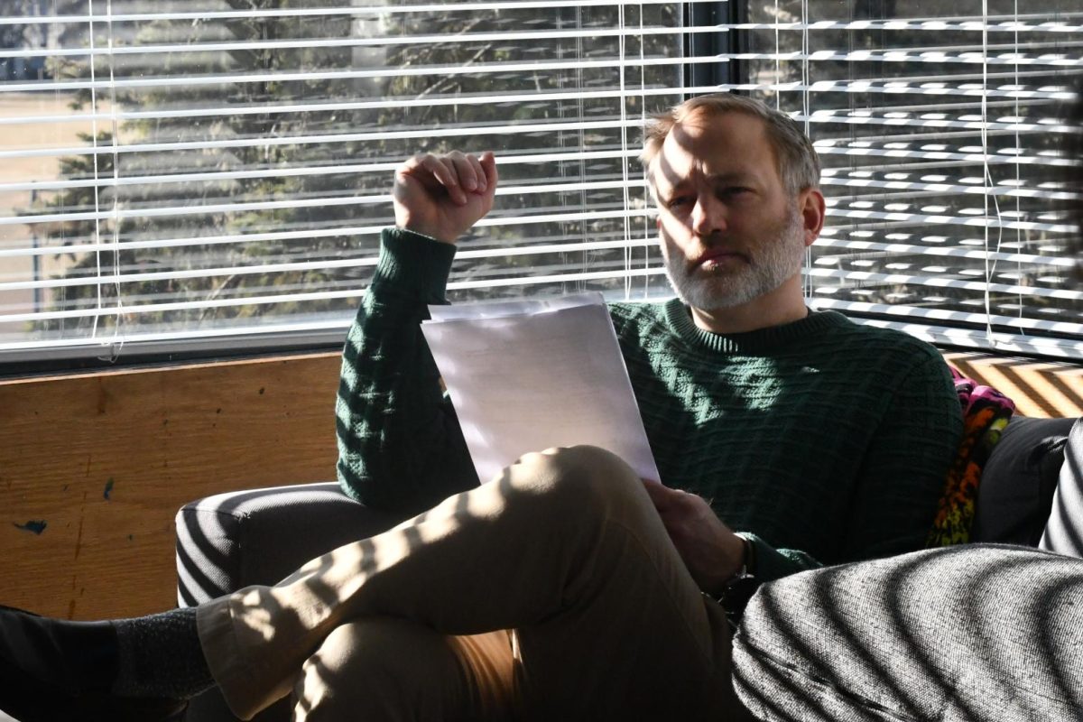 BIZZARE IDEAS. Advisor Jon Peterson listens in on his advisory discussing what to do for a social media promotion video for the STAR House project.