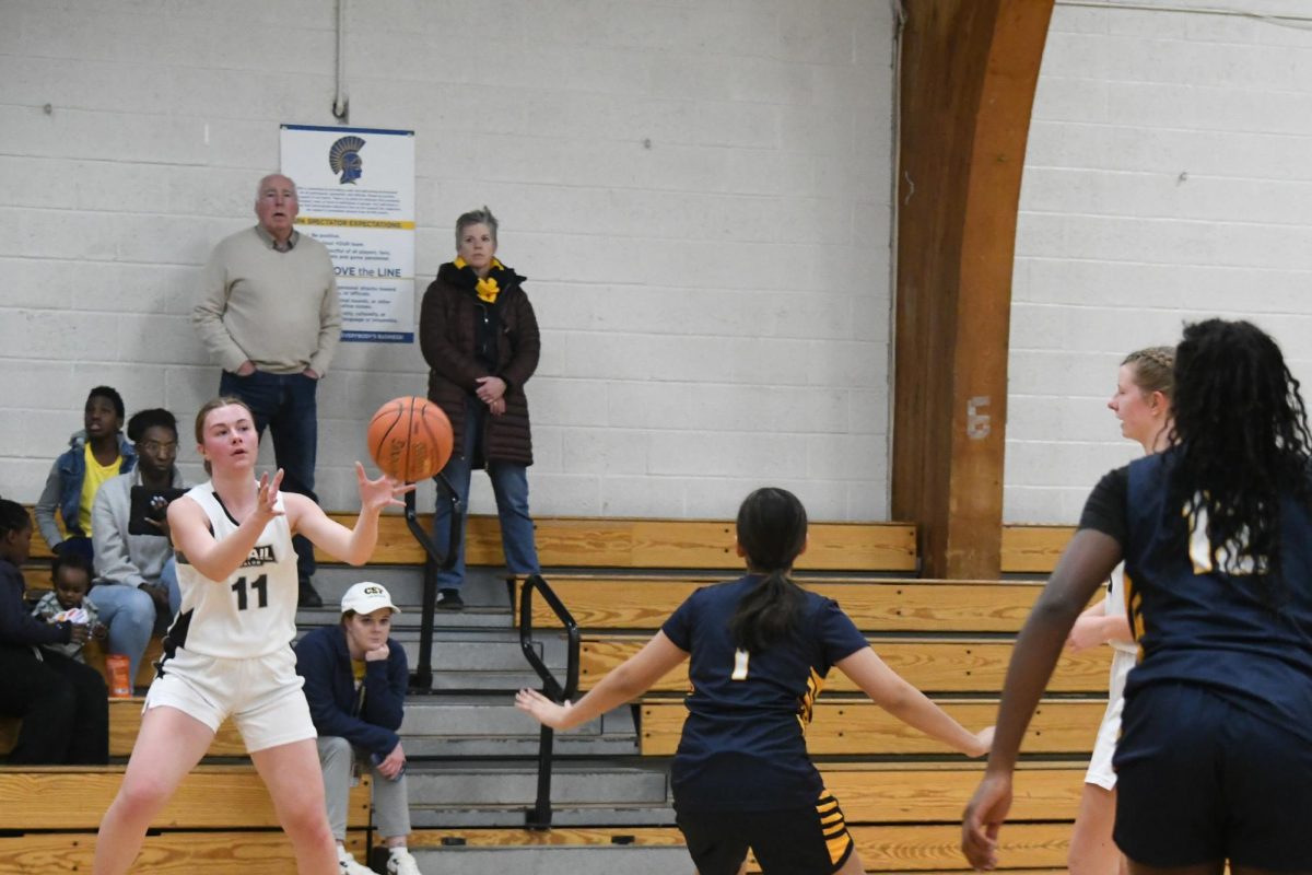 EYE ON THE PASS. 8th grader Zoya Jameel jumps forward to intercept the ball as Avail Academy attempts to pass at the top of the paint. 