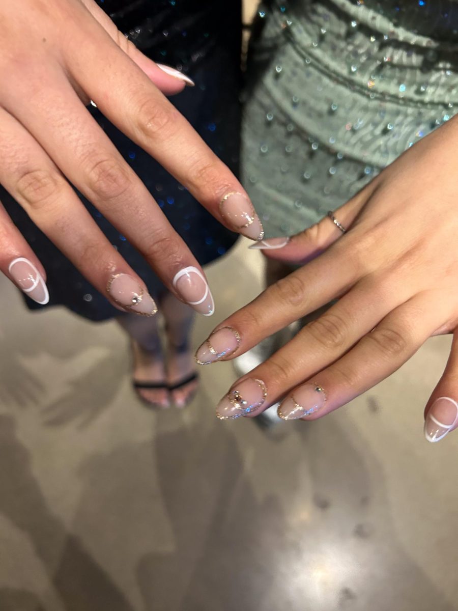 TWINNING WITH TWIN. Freshmen Sara Karmaliani and Sophie Karmaliani did their nails together for the dance and decided to match with each other.