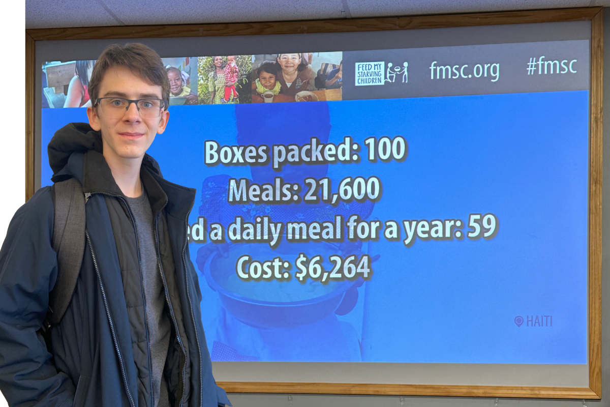 FEED HOPE. Sophomore Zach Berchenko packed meals with friends to complete some of his grade-level service hours. “I packed food with four other kids my age, and it was very fun talking with them,” Berchenko said. “Volunteering with others made [it] more fun.” (Photo Illustration: Olivia Campbell)