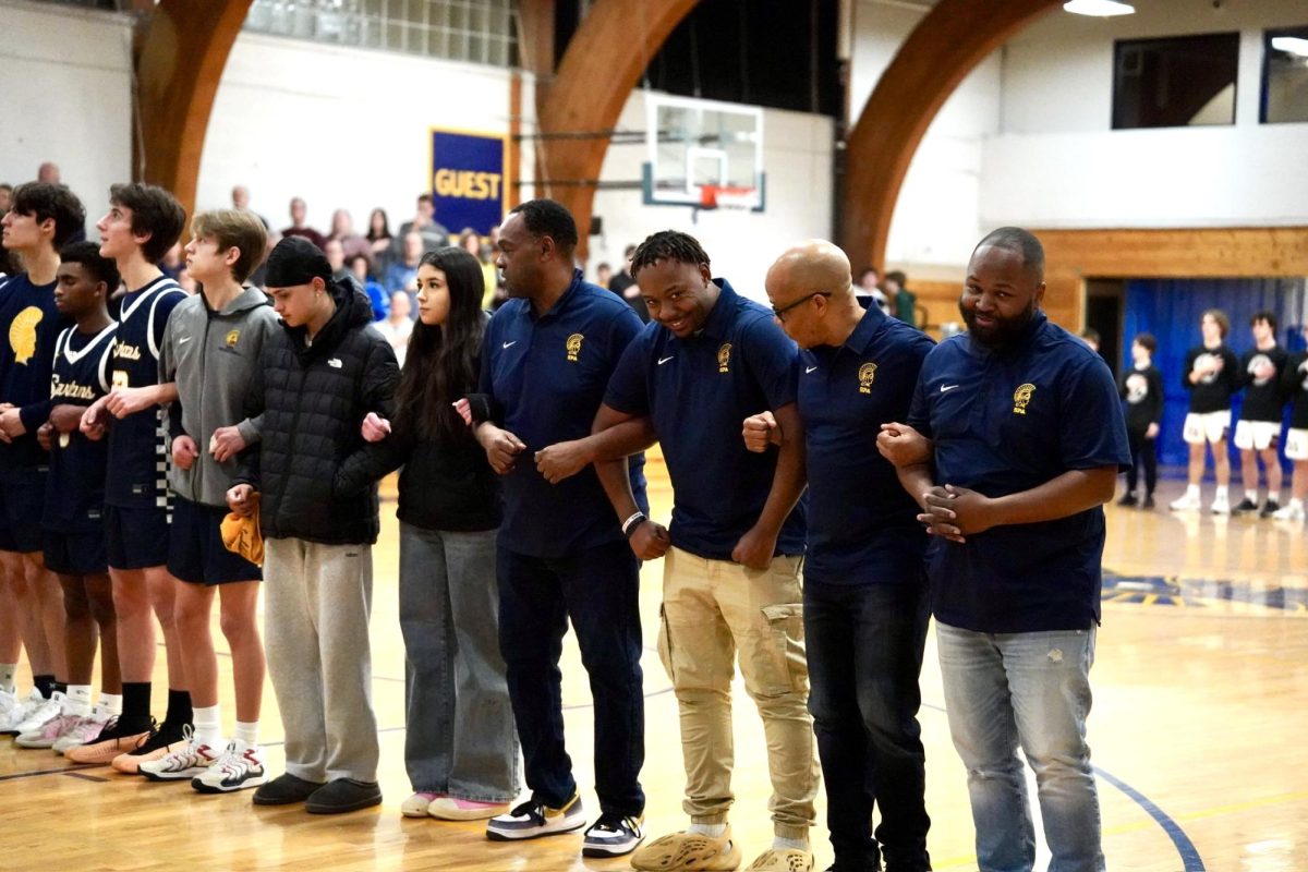 COACH CONFIDENCE. The boys basketball coaches also participate in the pregame tradition. 