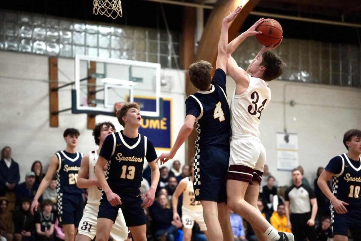 BLOCKED. Sophomore Elliot Pierach blocks the ball from a nova player trying to shoot. 