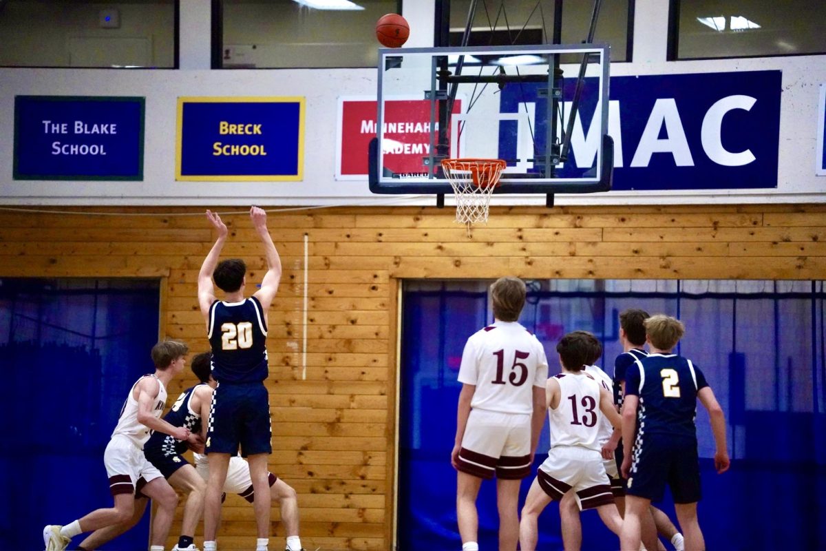 PERFECTION. Captain Nathan Rock shoots a free throw. Nova's players try and block out his teammates from gathering the rebound. 
