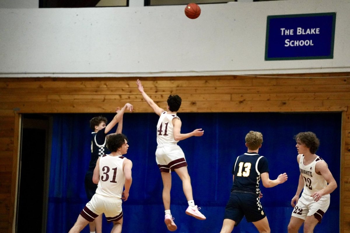 NO CAN DO. Sophomore Elliot Pierach shoots the ball, but a nova player unsuccessfully attempts to block the ball.
