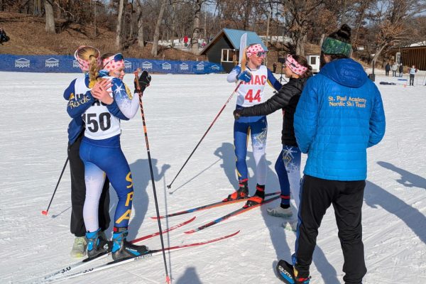 CONGRATS. Senior Inga Wing and Junior Maren Overgaard are congratulated after they finish their race. (Photo submitted by Maren Overgaard)