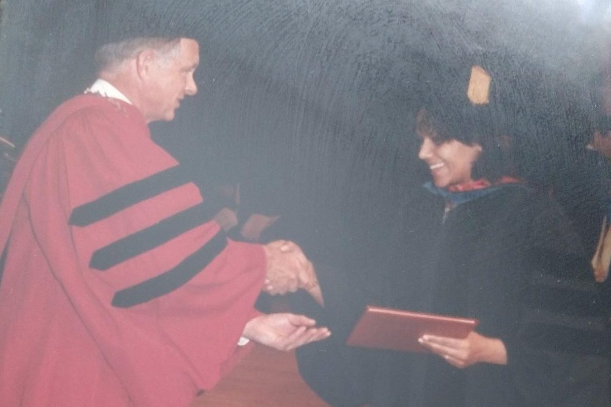 SHAKING HANDS, Dr. Hodges receives doctorate after her long studies. (Photo submitted by Sushmita Hodges)