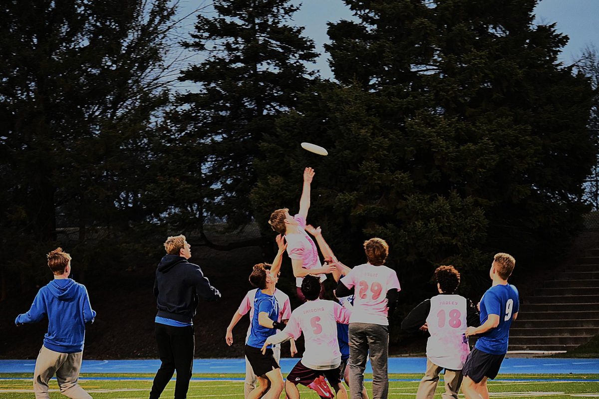 JUMP FOR IT! Captain Jesse Wussler launches into the air, battling gravity for a high-flying disc midair. “Winning the Rookie of the Year Award, freshman year, that's pretty cool,” he said, reflecting on his favorite ultimate frisbee memory. 
