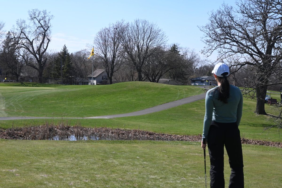 EYES ON THE PRIZE
Captain Peony Steele sets her sights on the next hole, envisioning her shot. “It allows me to get a feel for the shot to visualize my aim and distance with respect to environmental factors,” she commented.
