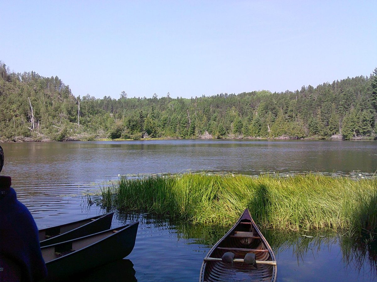 MENOYGYN MEMORIES. Bergad portages canoes around YMCA Camp Menogyn, making memories in the wilderness. (Submitted by Iris Bergad)