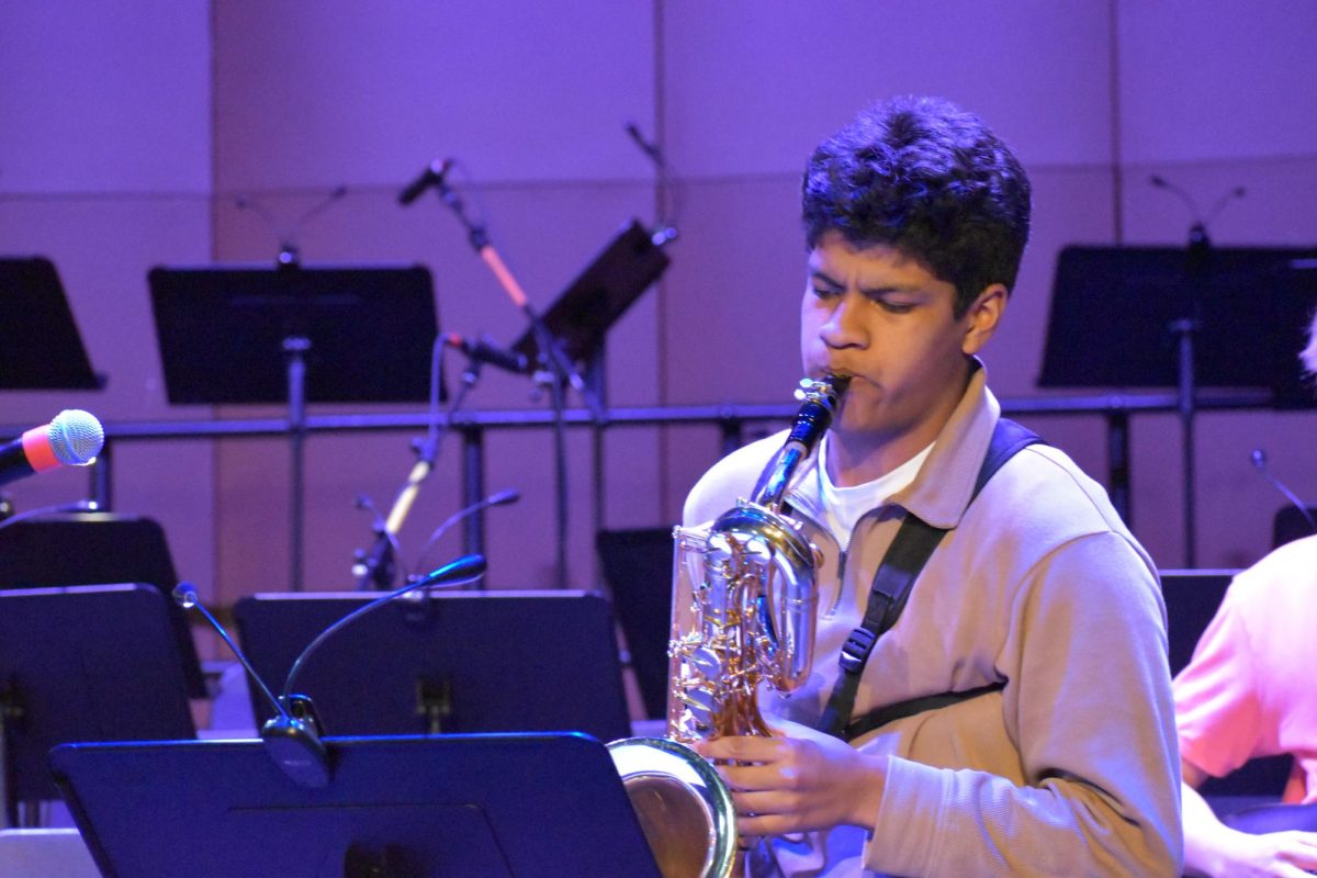PASSION. The group's namesake junior Juan Miguel Adams plays his baritone saxophone with a calm presence.