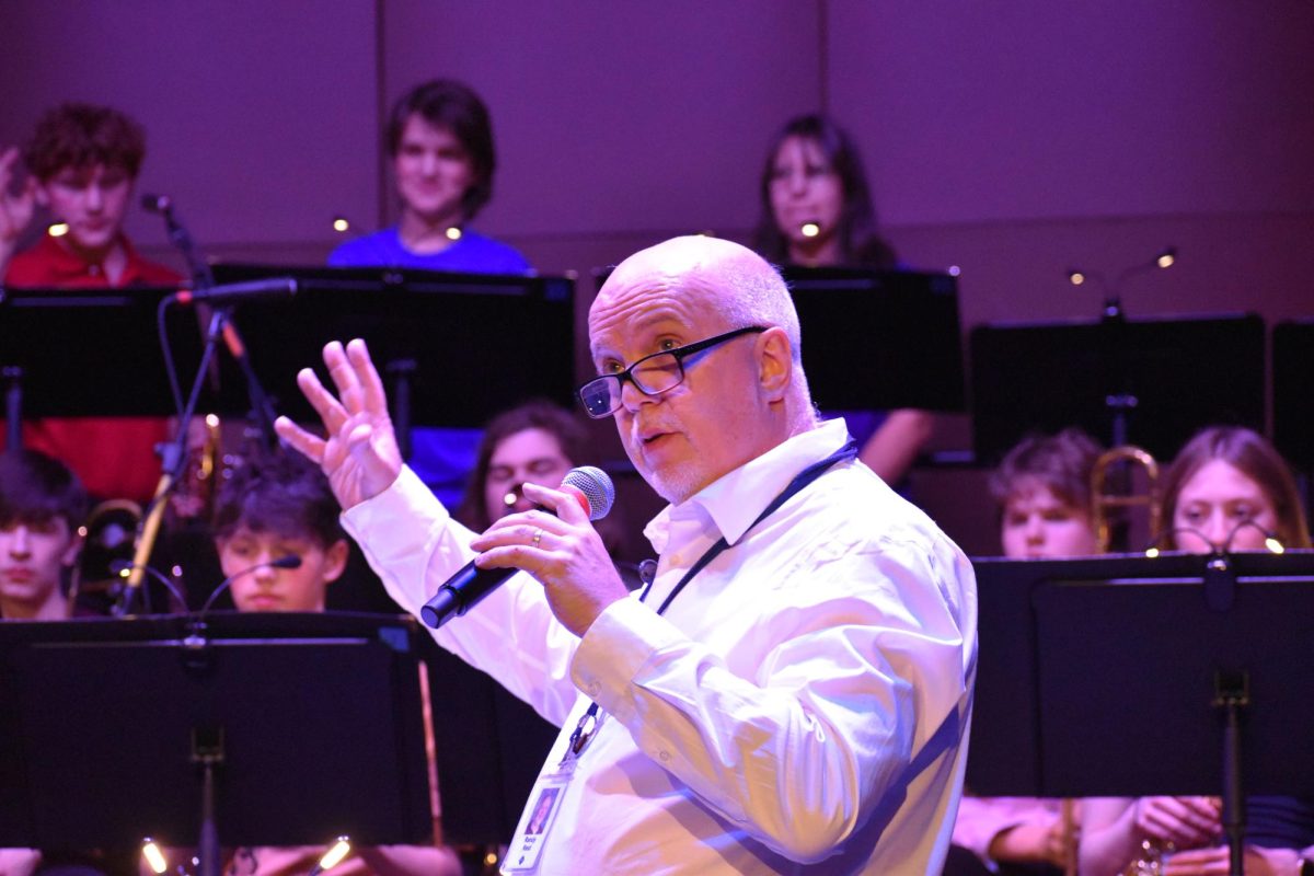 CONDUCTOR EMCEE. Head of Jazz Bands Randy Reid shouts out student musicians in the cabaret.