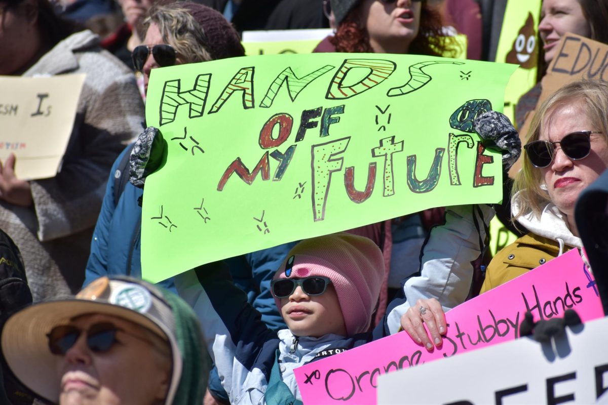 PASSIONATE PROTESTING. A child participates in the “Hands Off” protest at the State Capitol Apr. 5. Protests allow one to move from talking about an issue to acting on it; protesting can also combat isolation and hopelessness.