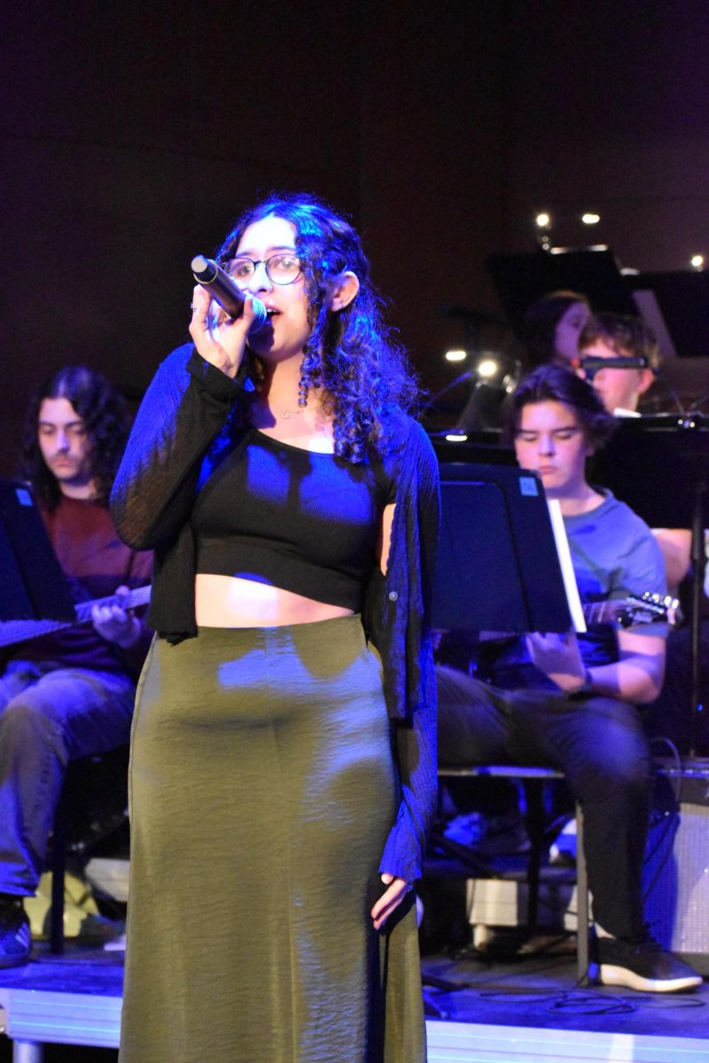 CONFIDENT POISE. Junior Frances Matthews sings confidently.