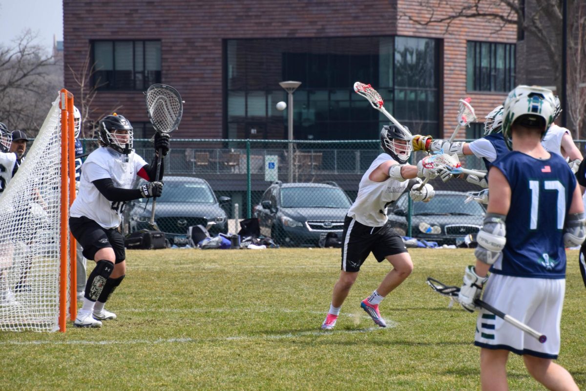 AJ IN ACTION. Goalie AJ Ridenour prepares to block a shot.