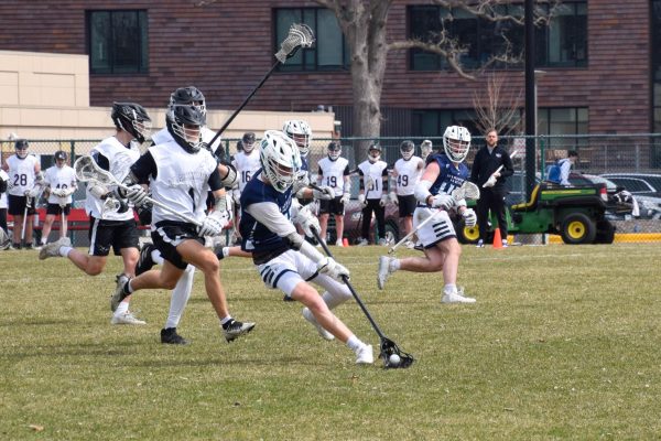 HOT PURSUIT. Blackhawks players chase after the player with the ball.