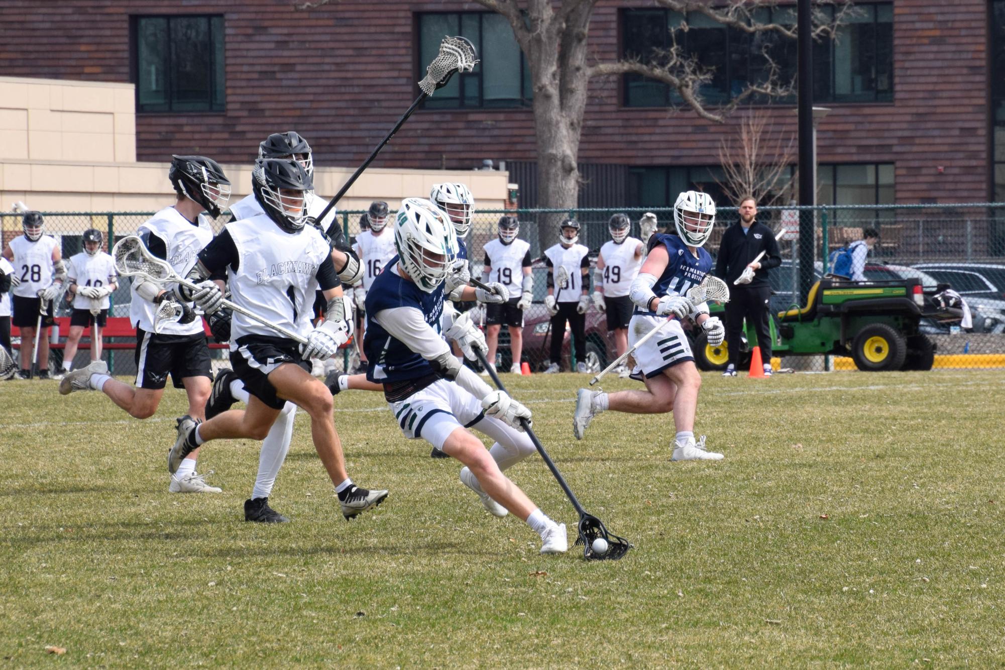 HOT PURSUIT. Blackhawks players chase after the player with the ball.