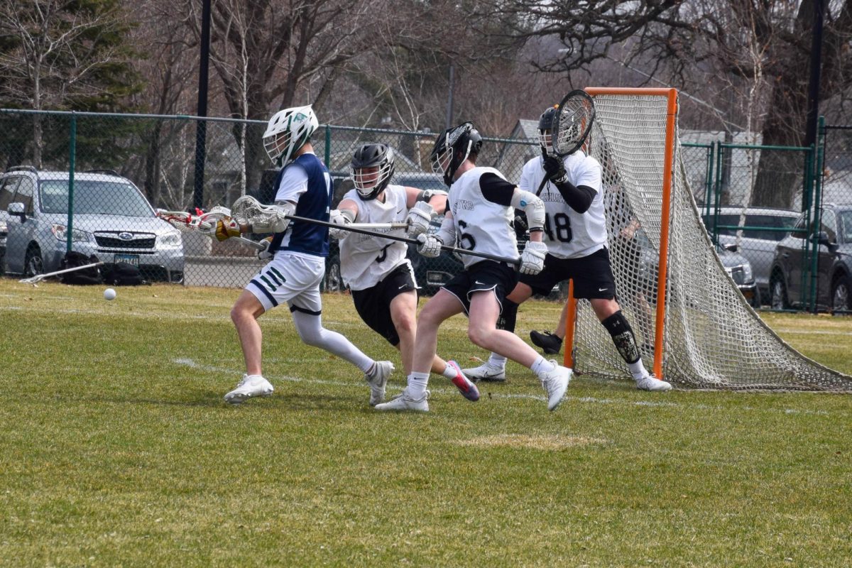 DEFEND AT ALL COSTS. Blackhawks defenders give their all to prevent a goal.