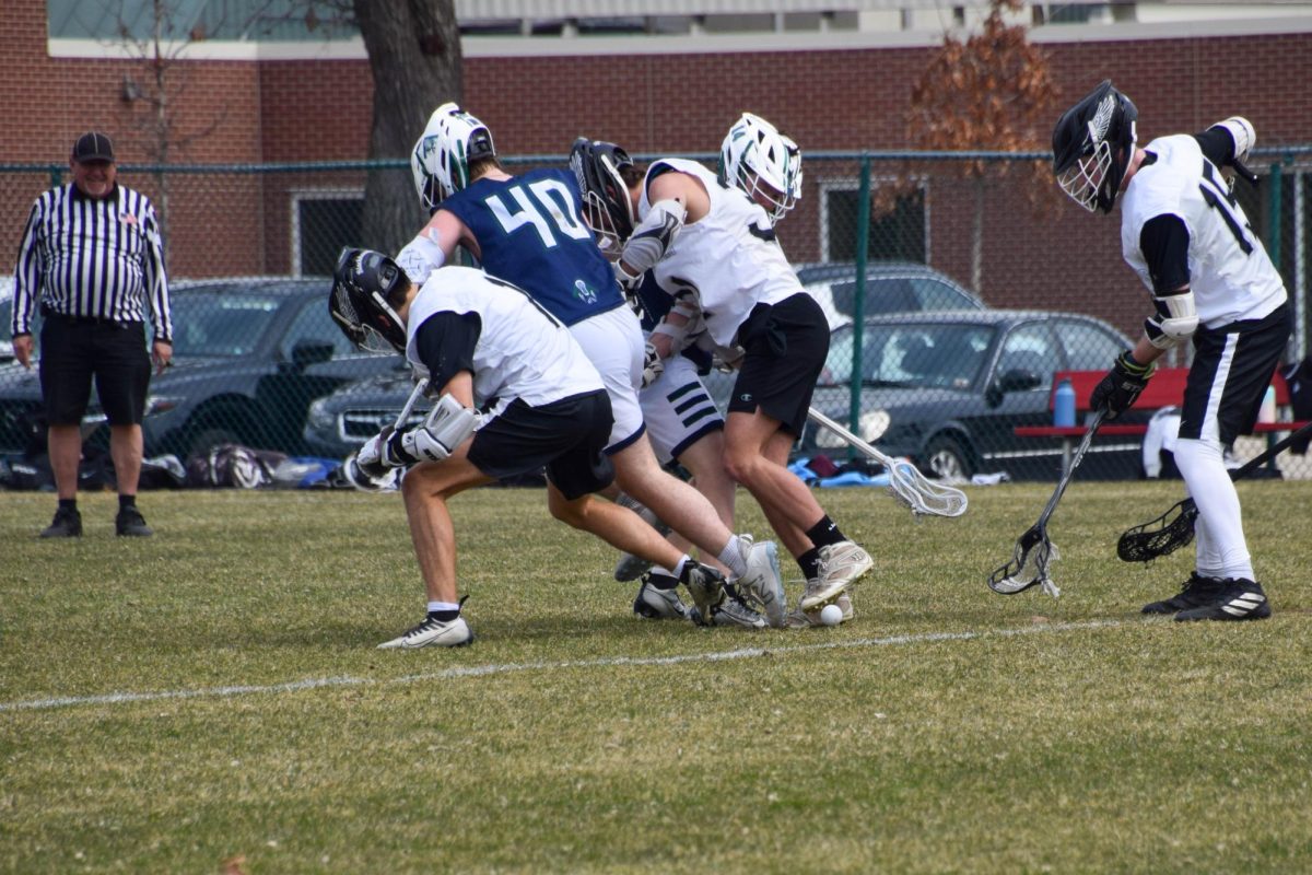 WHERE IN THE HECK? Players from both teams scramble for the ball.