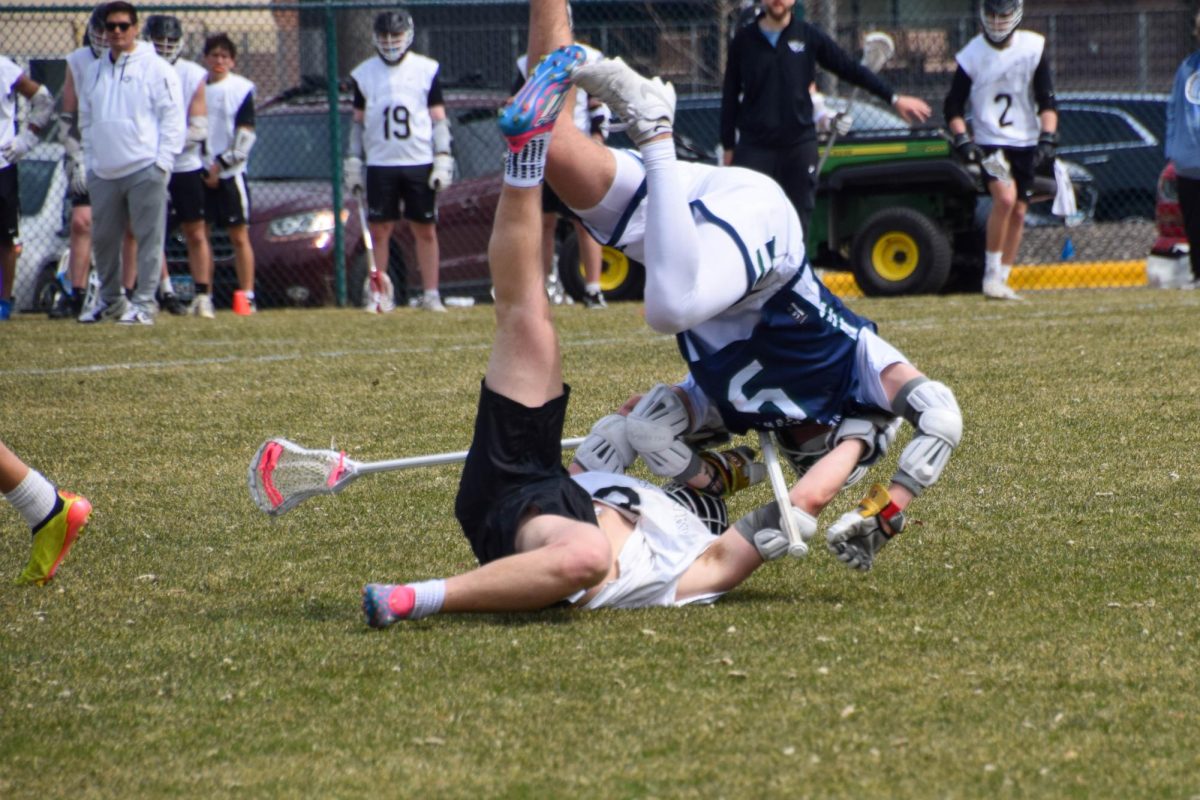 FLIPPING FORWARD. A Proctor player gets flipped in the heat of the game.