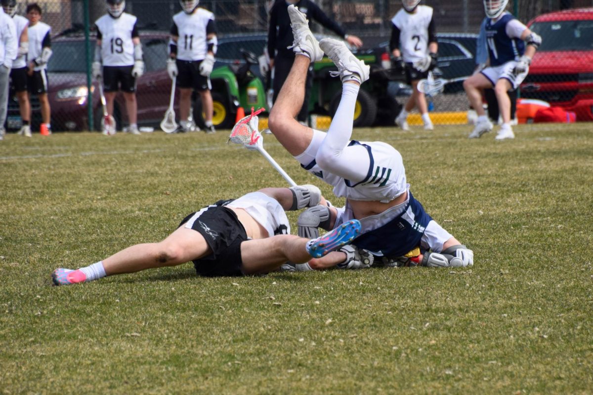 FLIP. A Proctor player lands upside down after charging Dylan Bump and getting flipped.