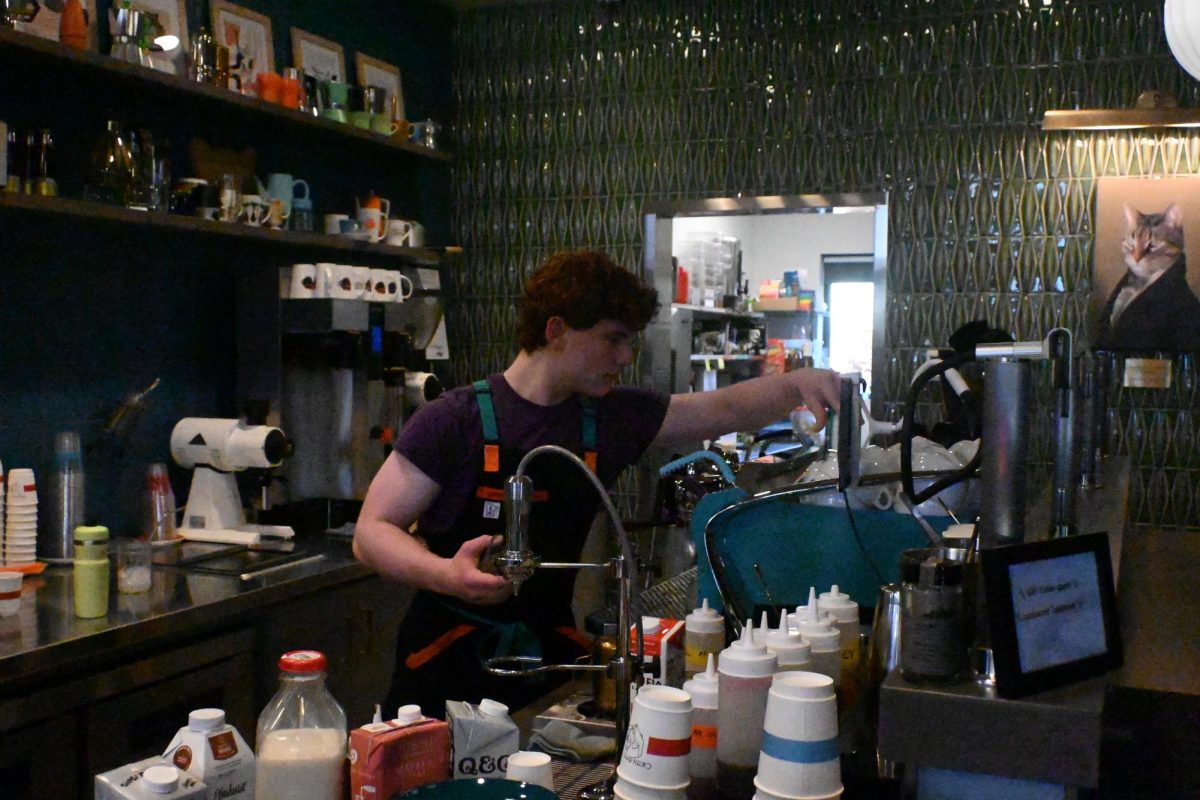 AT WORK Solomon Beardsley crafts drinks for the Cat Cafes customers. 