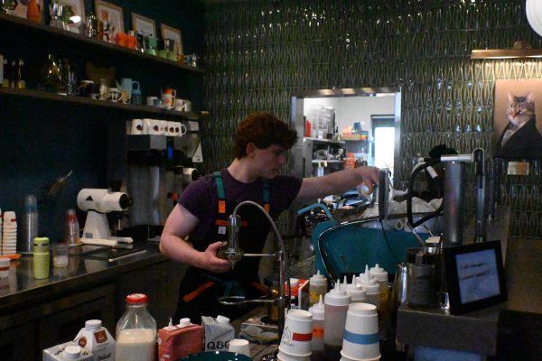 AT WORK Solomon Beardsley crafts drinks for the Cat Cafes customers. 